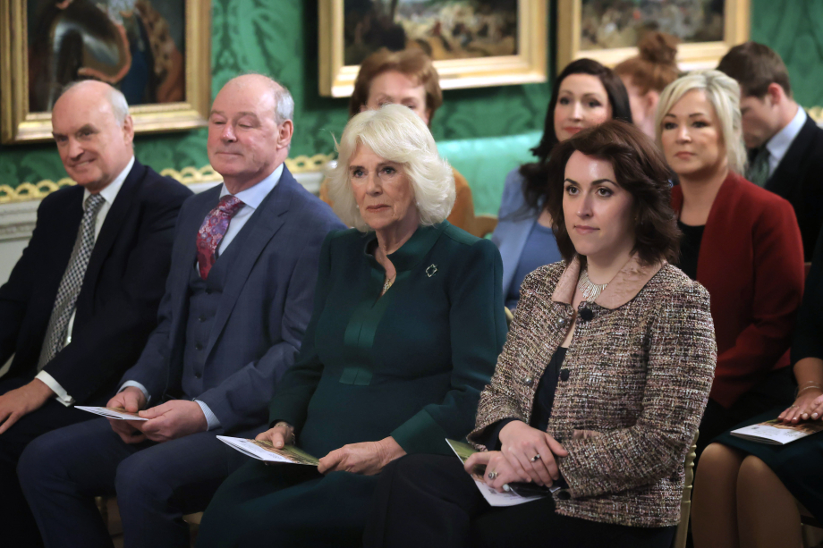 Queen Camilla (centre) attends an event hosted by the Queen's Reading Room to mark World Poetry Day at Hillsborough Castle in Belfast.