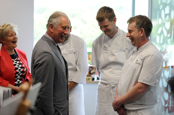 The Prince of Wales meets kitchen development staff during a tour of Abergavenny Fine Foods