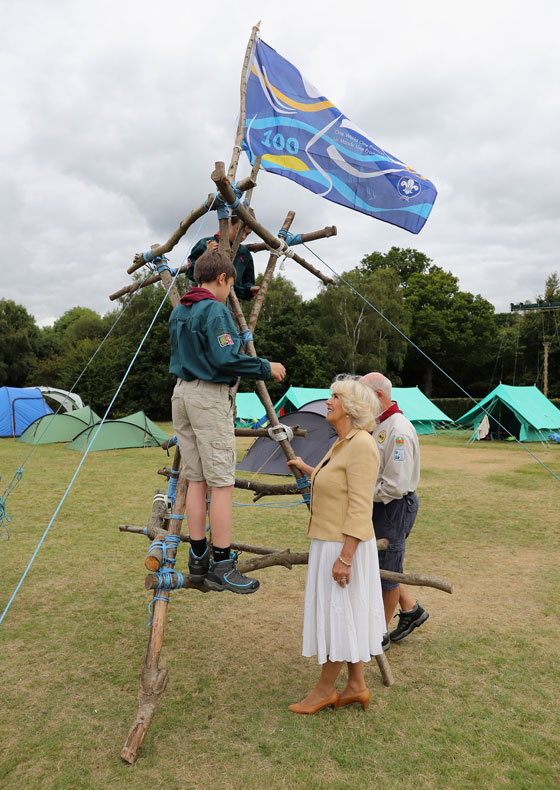 The Duchess of Cornwall meets Scouts during a visit to the Poppy Pod Village