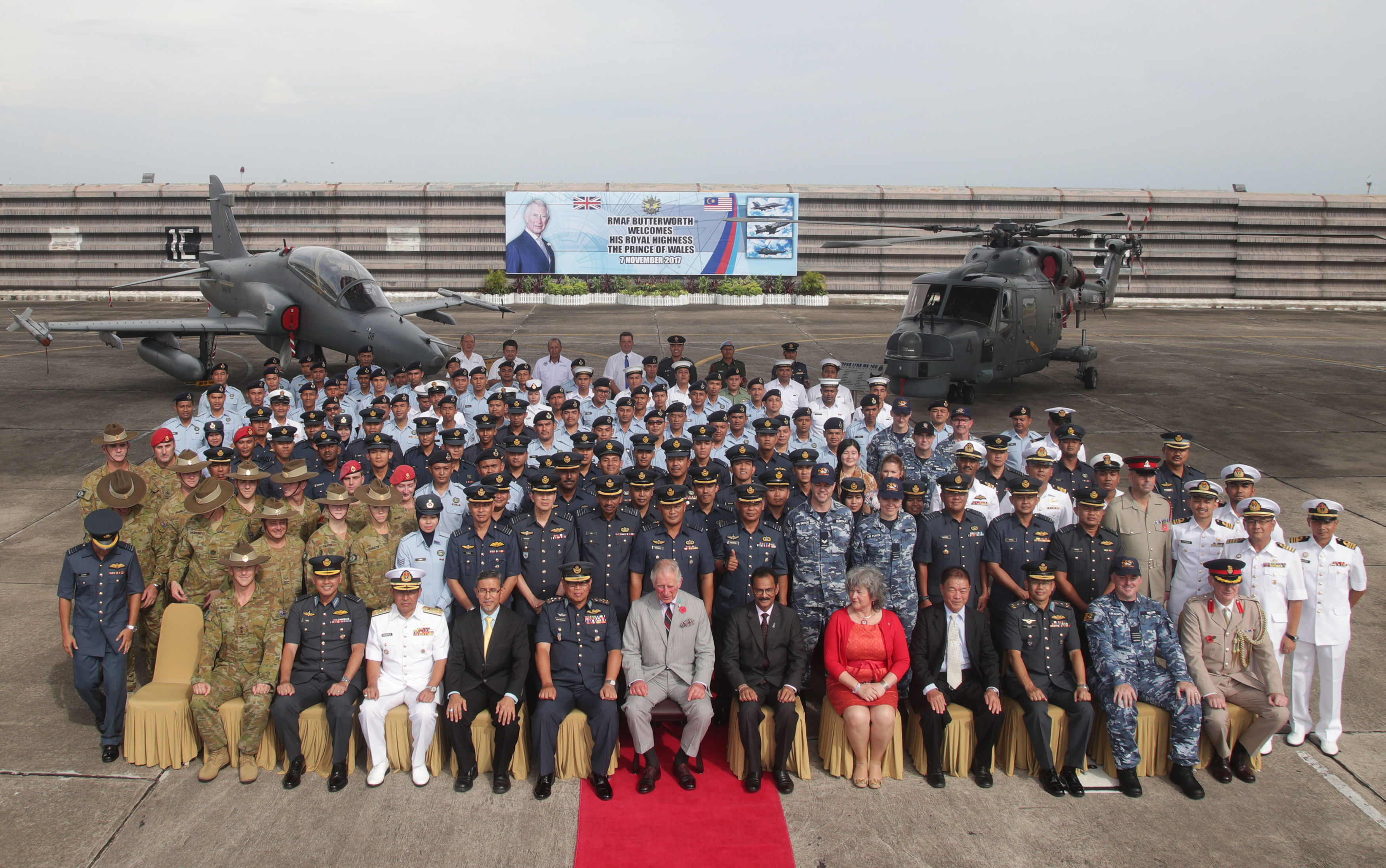 The Prince of Wales sits for a group photo with members of the Royal Malaysian Air Force