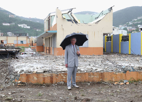 The Prince of Wales visits the remains of Elmore Stoutt's High School in Road Town during a visit to the island of Tortola, in the British Virgin Islands