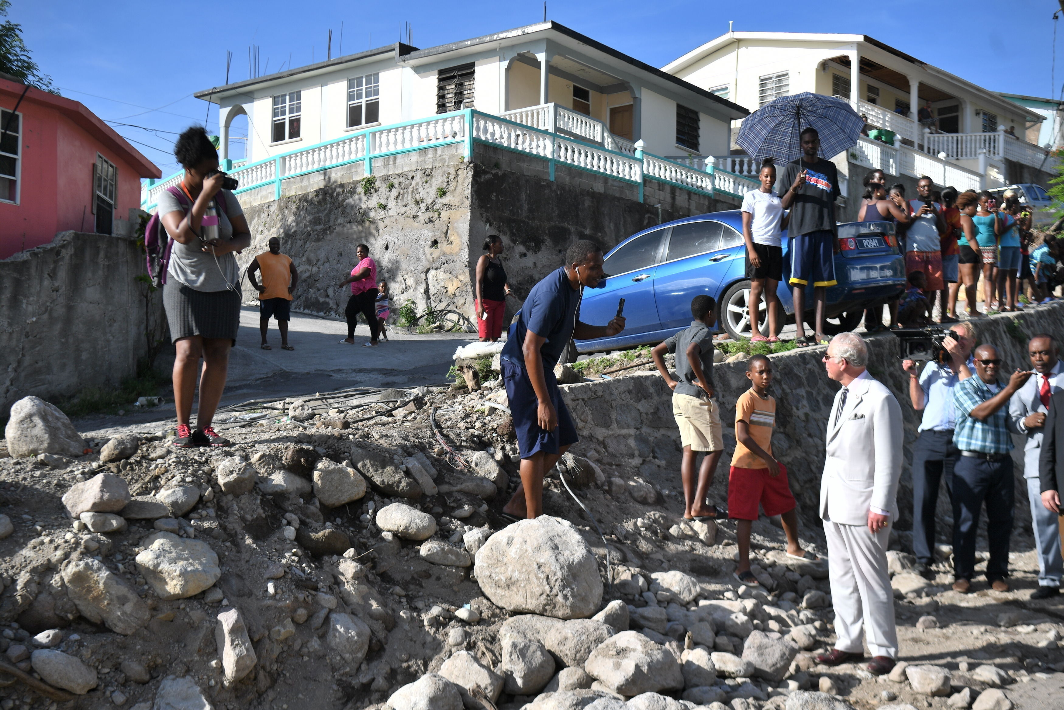 The Prince of Wales meeting residents in Pointe Michel on Dominica, as he continues his tour of hurricane-ravaged Caribbean islands.