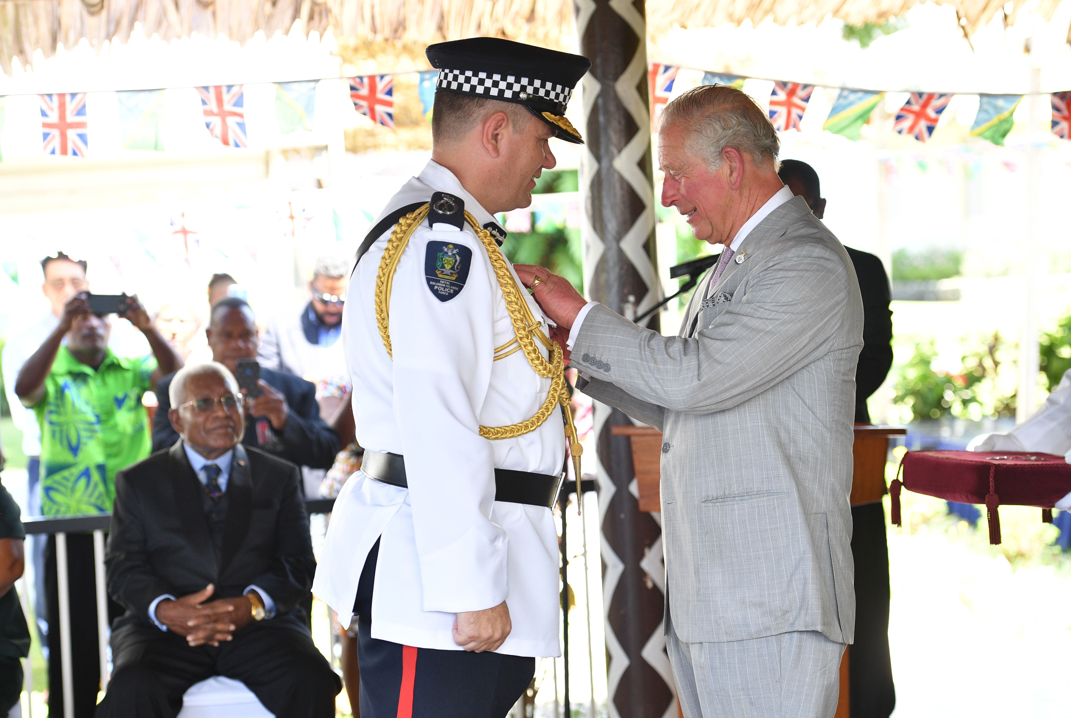 The Prince of Wales honours people during an Investiture ceremony 