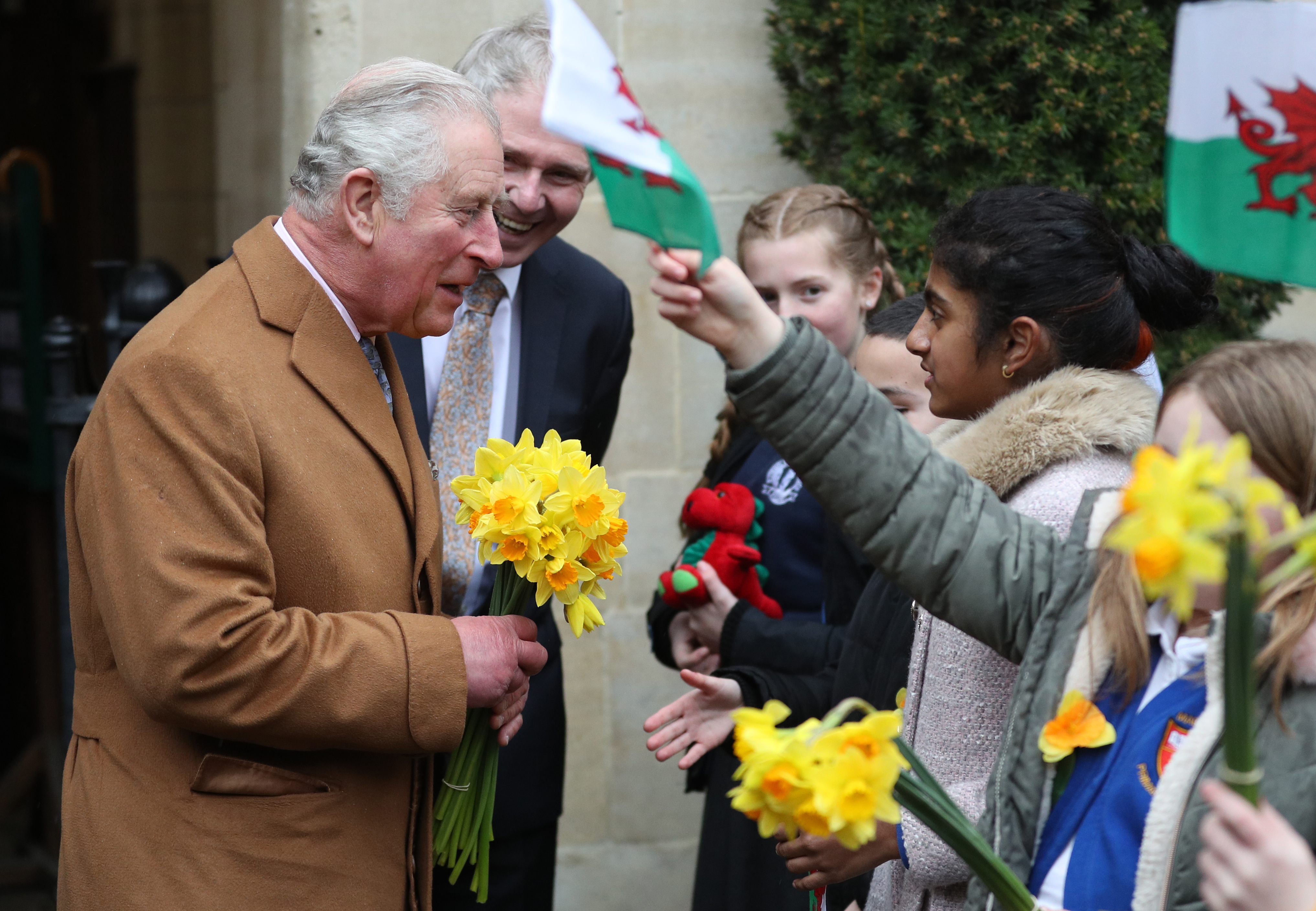 The Prince receiving daffodils from primary school children