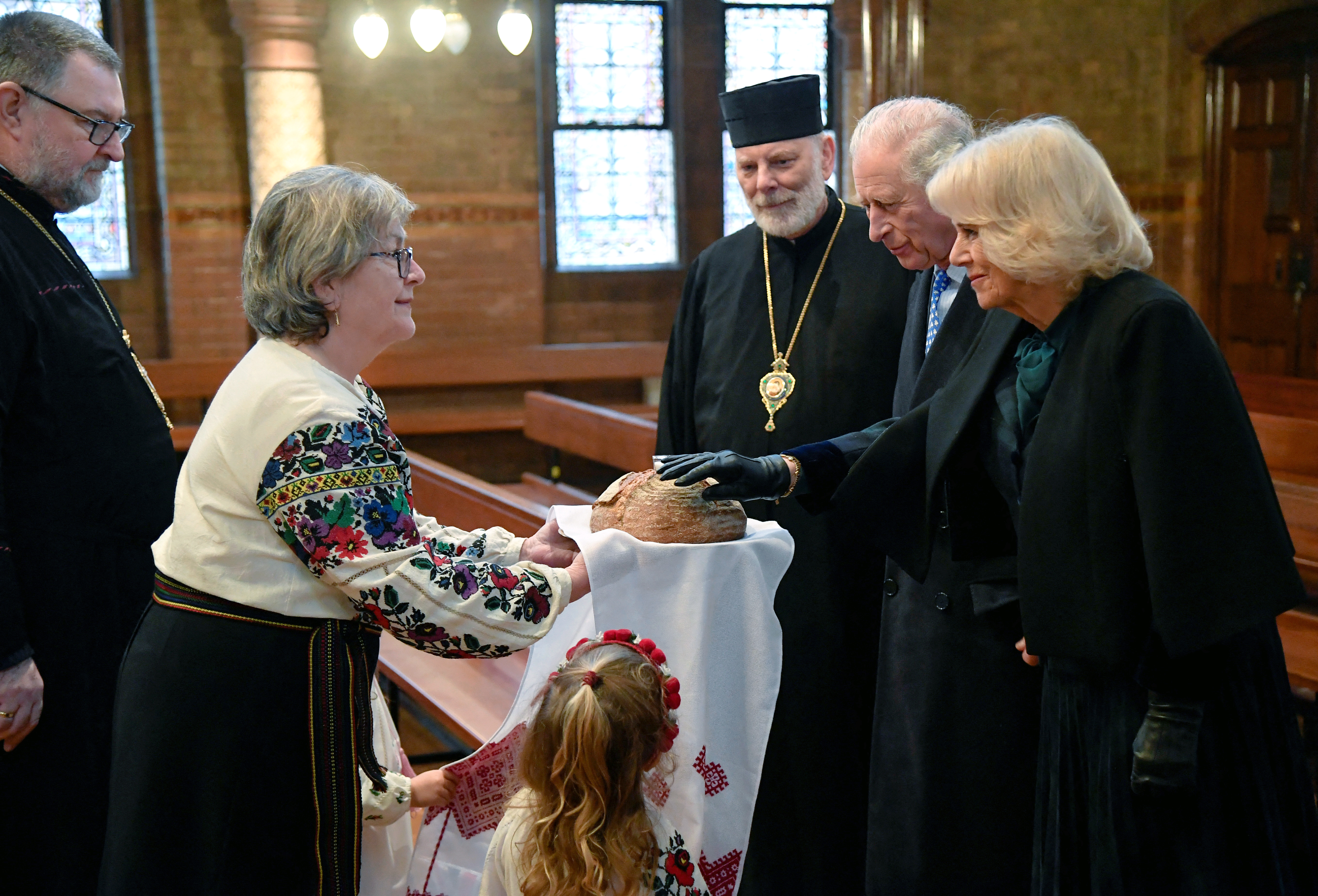 Their Royal Highnesses receive a traditional offering of bread at salt at the Ukrainian Cathedral