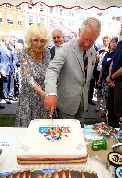 TRH cut a cake to mark the Taste of the West's 25th Anniversary Food Fair in Exeter, Devon