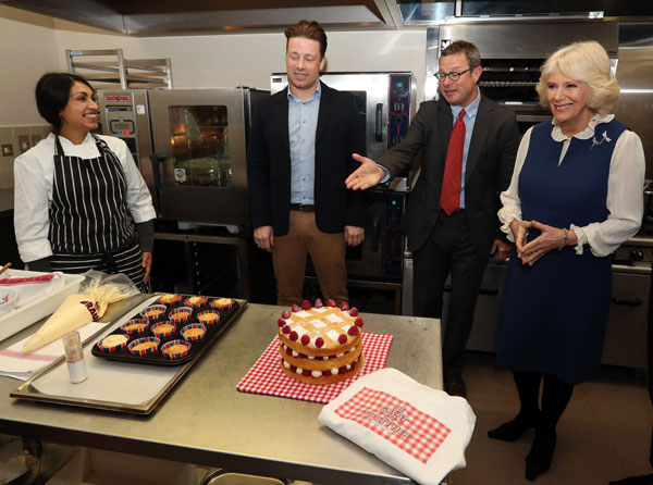 The Duchess in the Clarence House kitchen during a reception for the Great Get Together