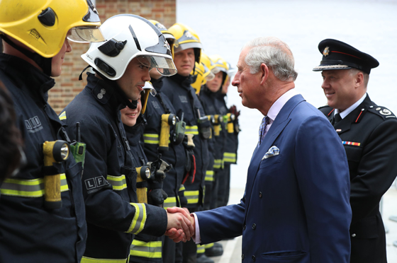 The Prince of Wales meets members of Blue Watch during his visit to Shadwell Fire Station