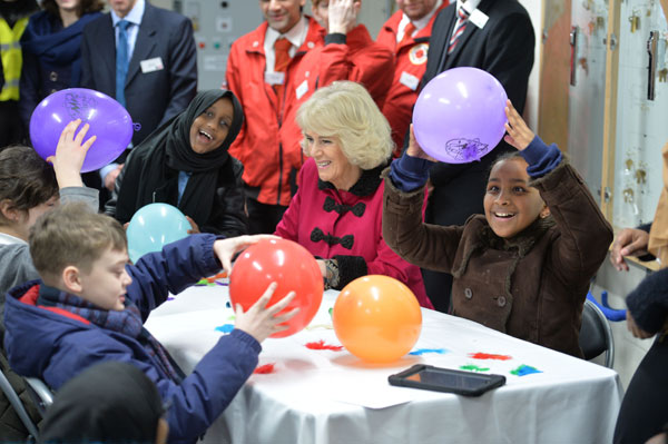 The Duchess of Cornwall with children learning about static electricity