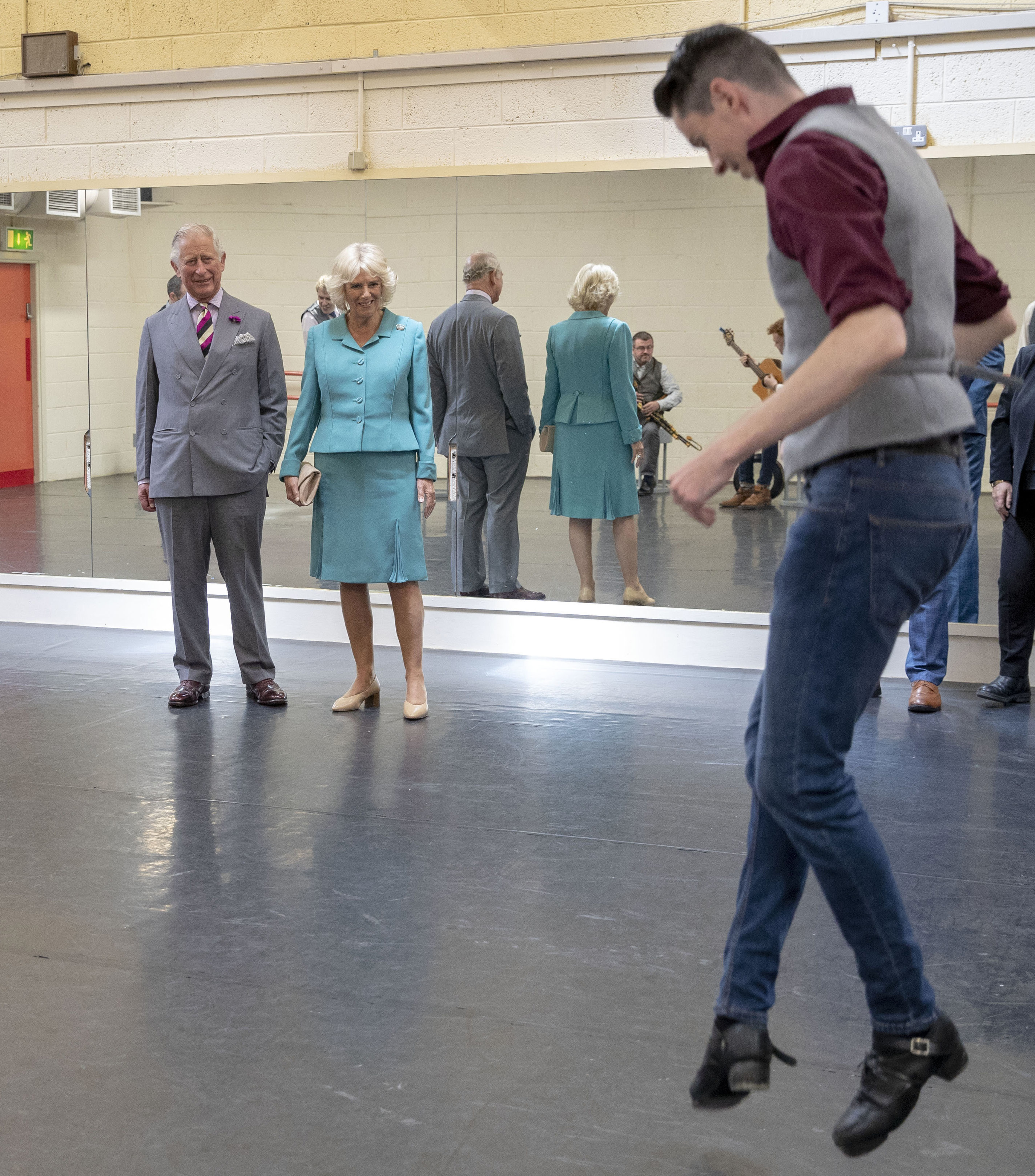 The Prince of Wales and The Duchess of Cornwall watch performers rehearse during their visit to the Siamsa Tire National Folk Theatre of Ireland in Co Kerry, Ireland