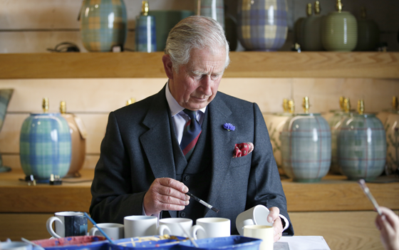 The Prince of Wales, also known as the Duke of Rothesay, paints a mug during a visit to Anta home furnishings in Fearn, Scotland.