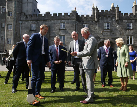 The Prince of Wales tries his hand at hurling during a visit to Kilkenny, Ireland