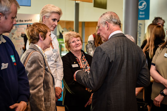The Prince of Wales speaks to staff and volunteers during a visit to the Wildfowl and Wetlands Trust's Slimbridge Wetland Centre