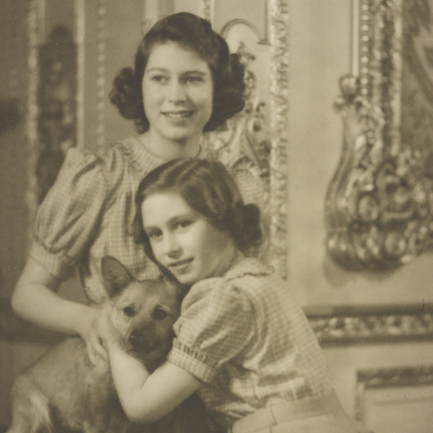 Princess Elizabeth and Princess Margaret with a Corgi