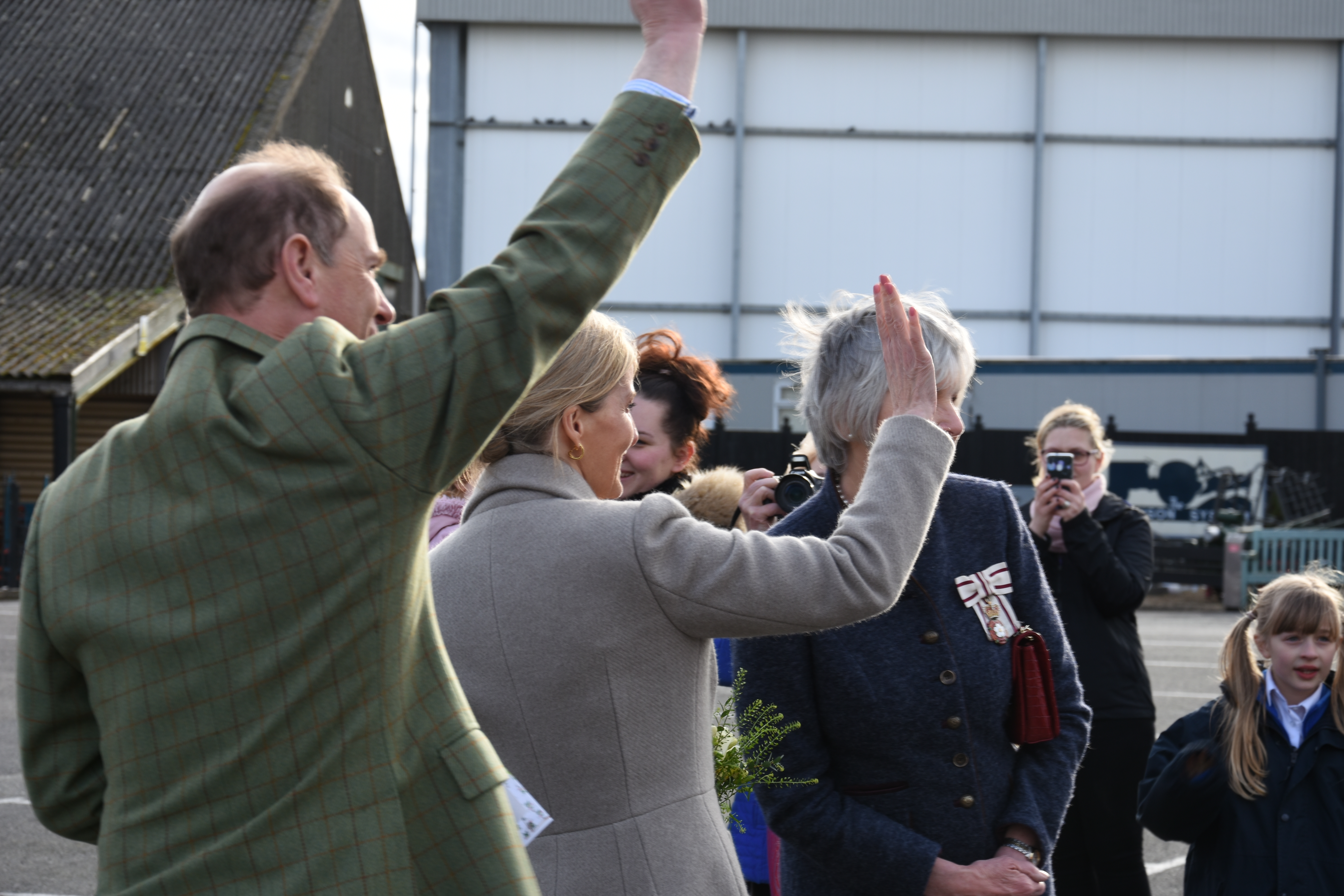 The Earl and Countess of Wessex wave goodbye as they leave the Tiptree jam factory