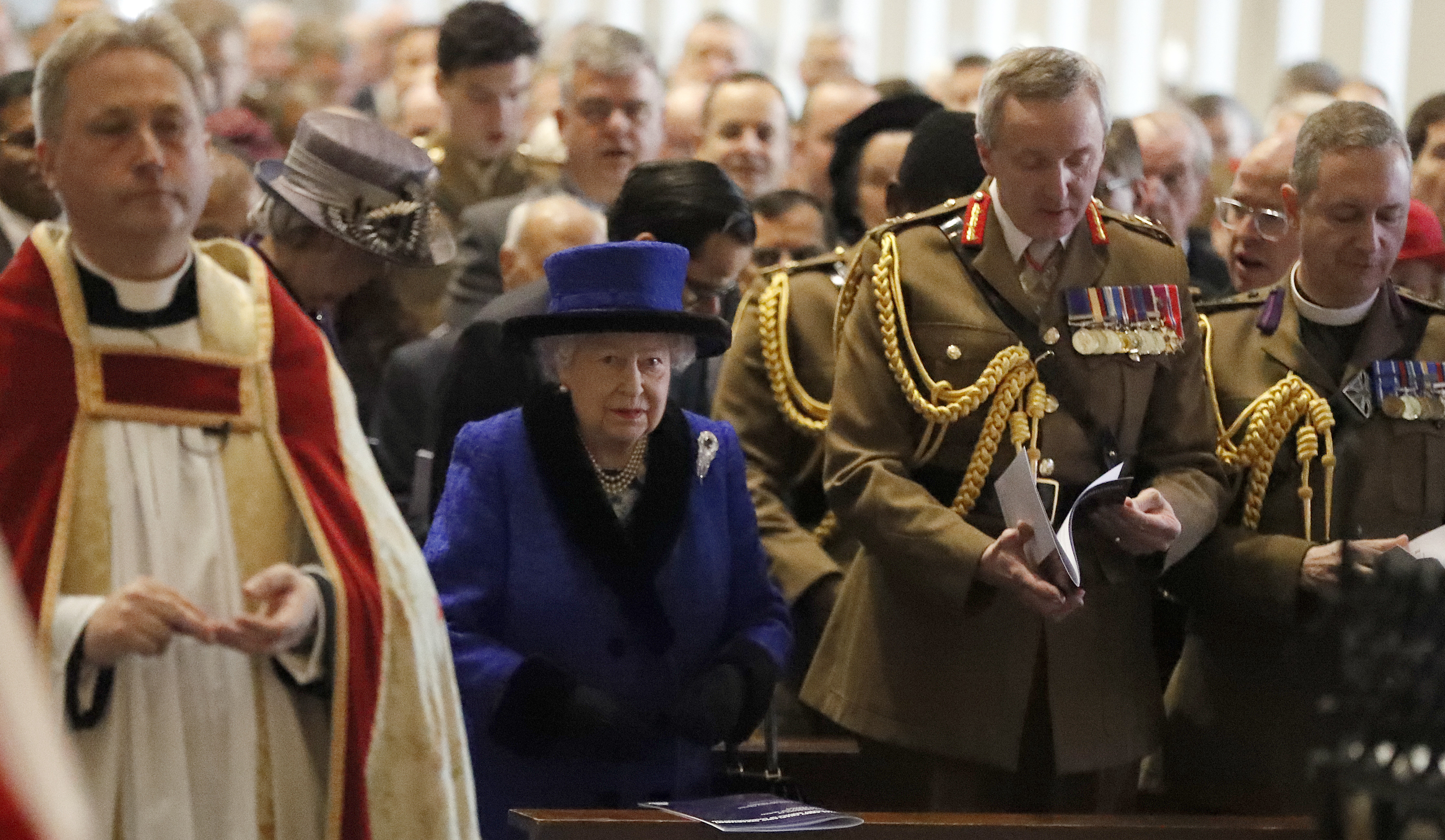 Queen Elizabeth II attends a service to celebrate the centenary of the granting by King George V of the prefix 'Royal' to the Royal Army Chaplains' Department, at the Guards' Chapel, Wellington Barracks, London.