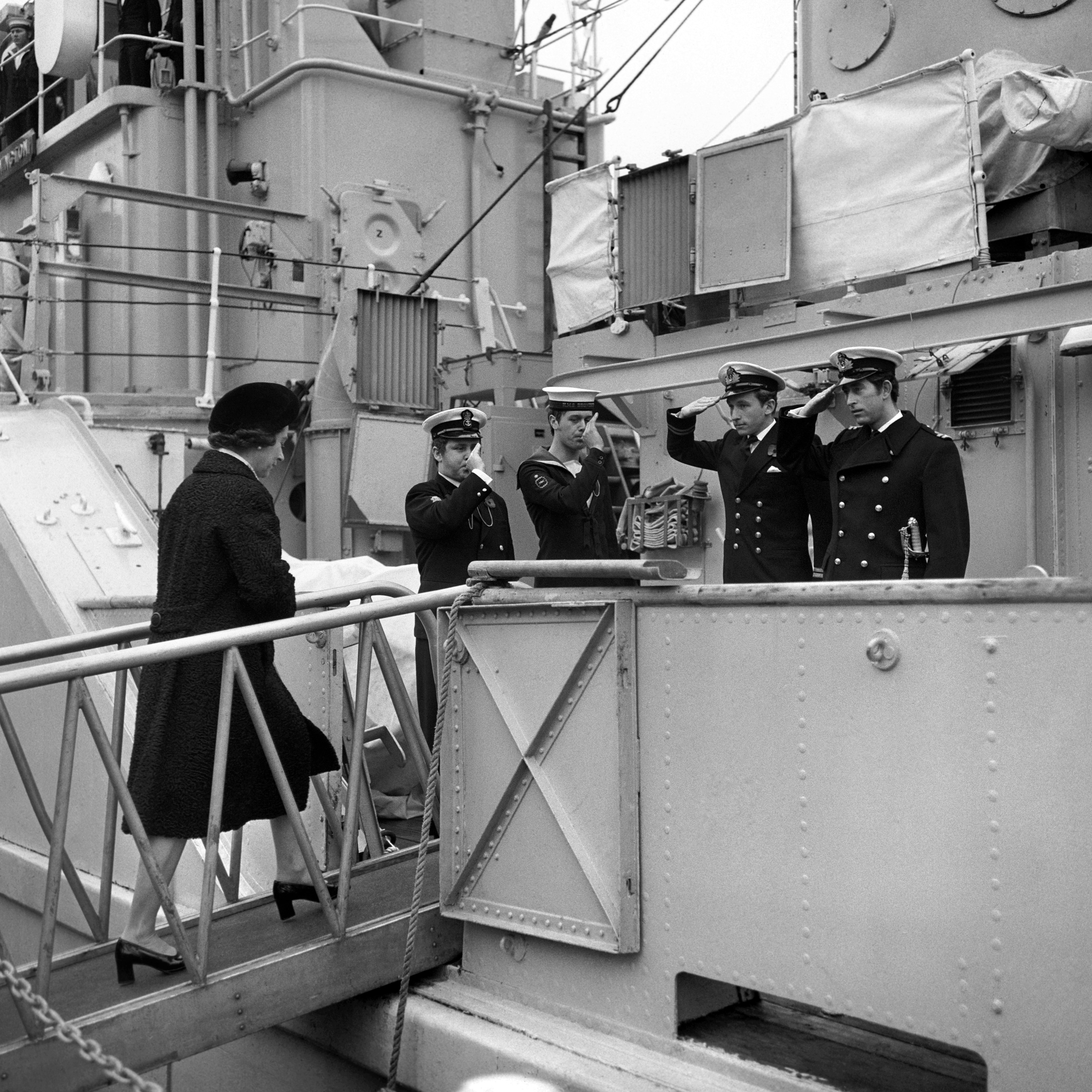 Queen Elizabeth II is piped aboard HMS Bronington to visit the ship's commander, The Prince of Wales.
