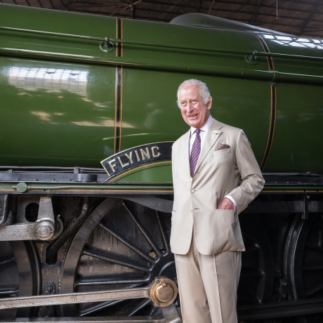 The King stands in front of the Flying Scotsman