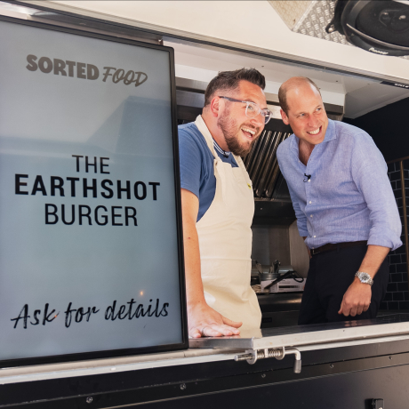 The Prince of Wales with Sorted Food co-founders Jamie (left) and Be (right) in a burger van