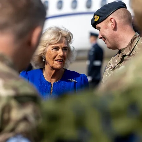 The Queen (L) talks to a member of the British Royal Air Force (R)