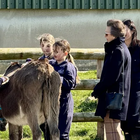 The Princess Royal in conversation with children on the farm