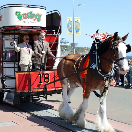 The King rides on one of the horse trams during a visit to Douglas Promenade