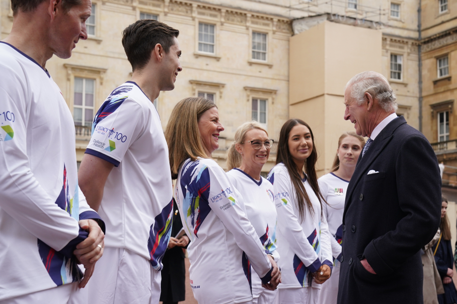The King with members of the Australian Legacy Torch Relay