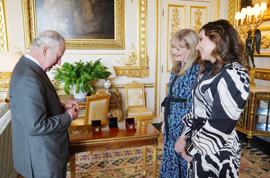 The King is presented with a commemorative coin by The Royal Mint