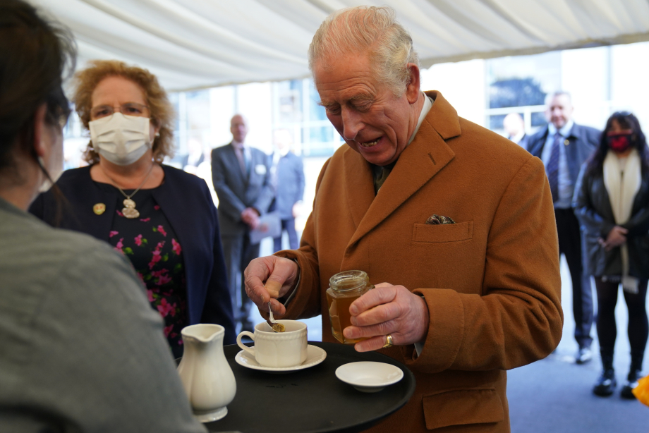 The King puts a spoonful of honey in his tea