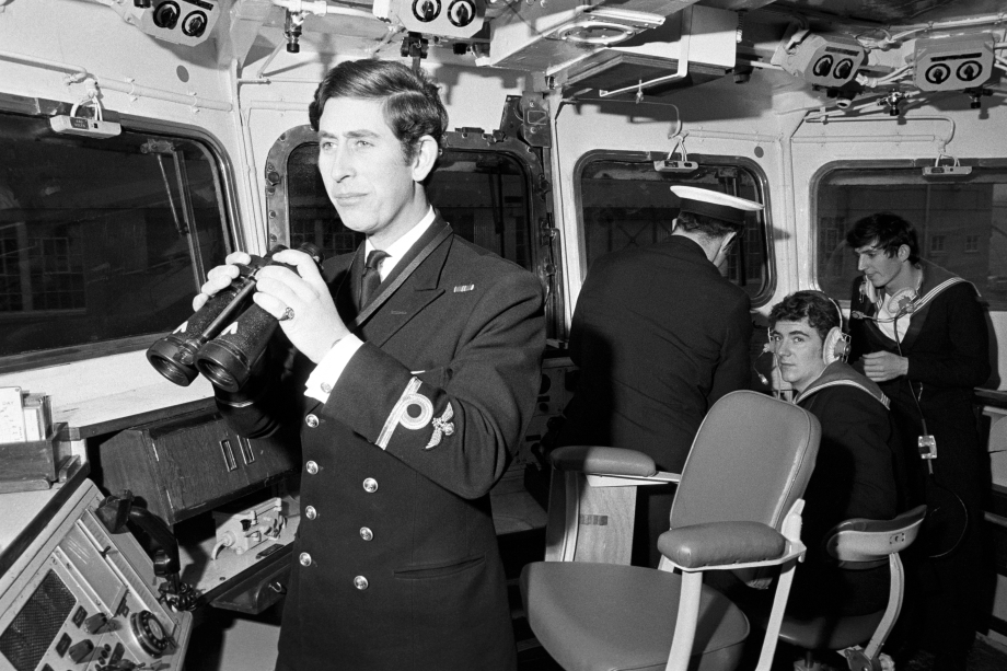 The Prince of Wales in naval uniform onboard a Royal Navy ship
