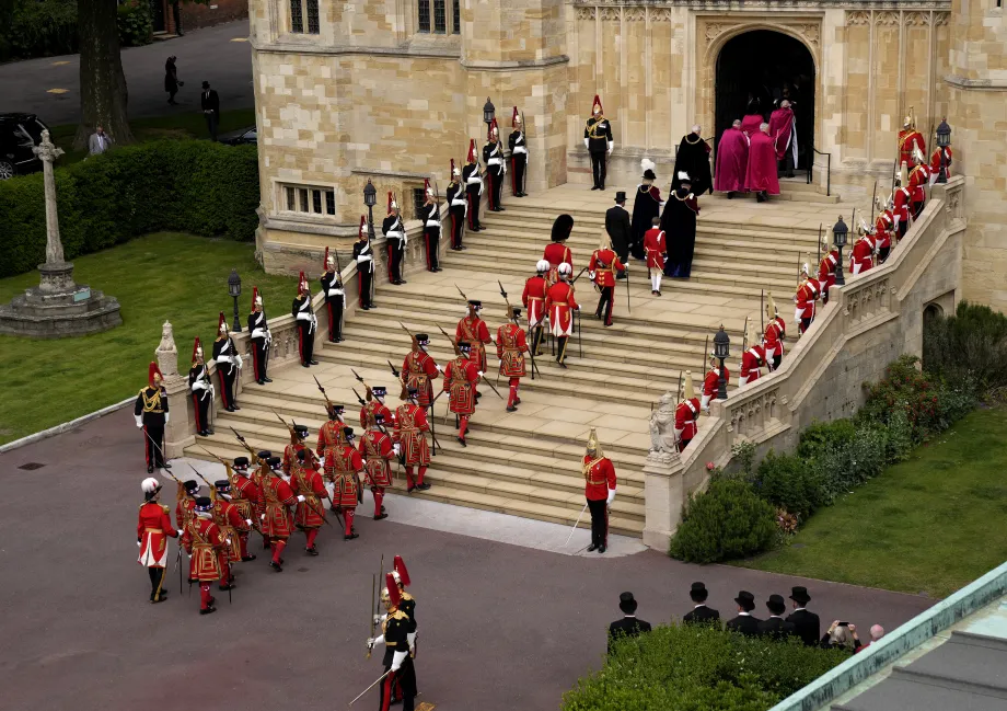 The King and Queen (as The Prince of Wales and The Duchess of Cornwall) enter St George's Chapel for the Order of the Garter Service, 2022.