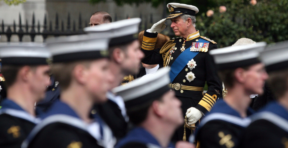 The King salutes marching naval personnel