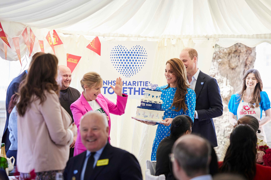 The Princess of Wales carries an NHS birthday cake