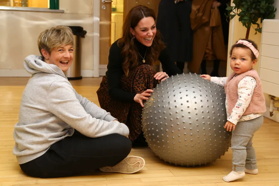 The Princess of Wales with a mother and child