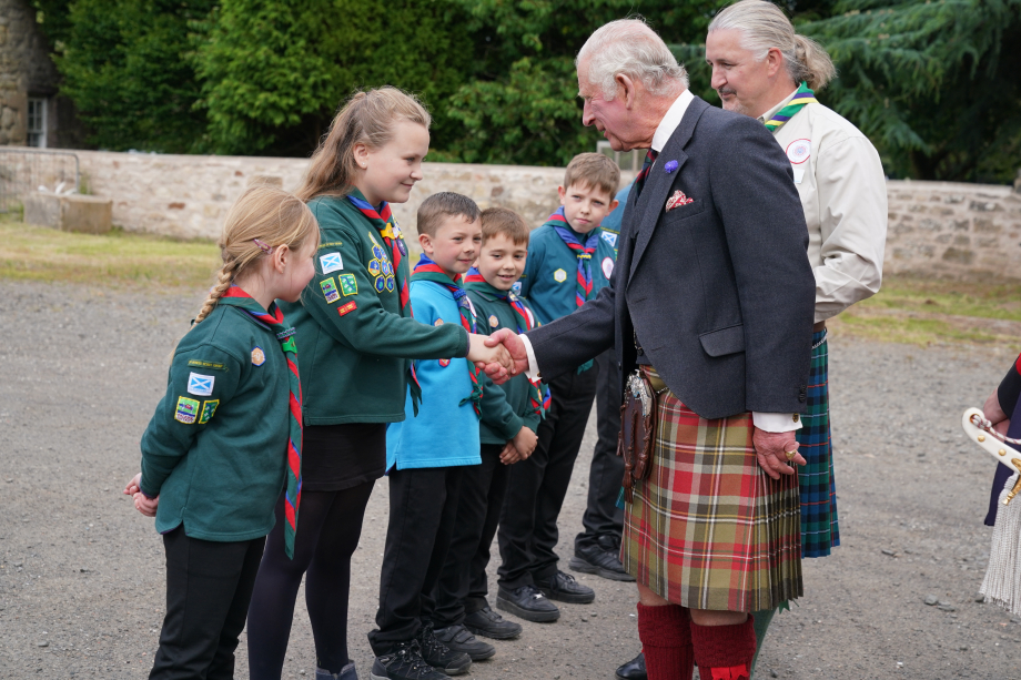 The King is greeted by schoolchildren