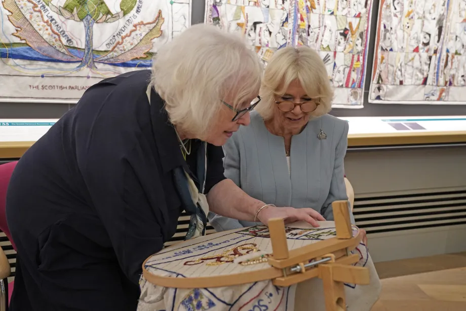 The Queen views the final panel of the tapestry