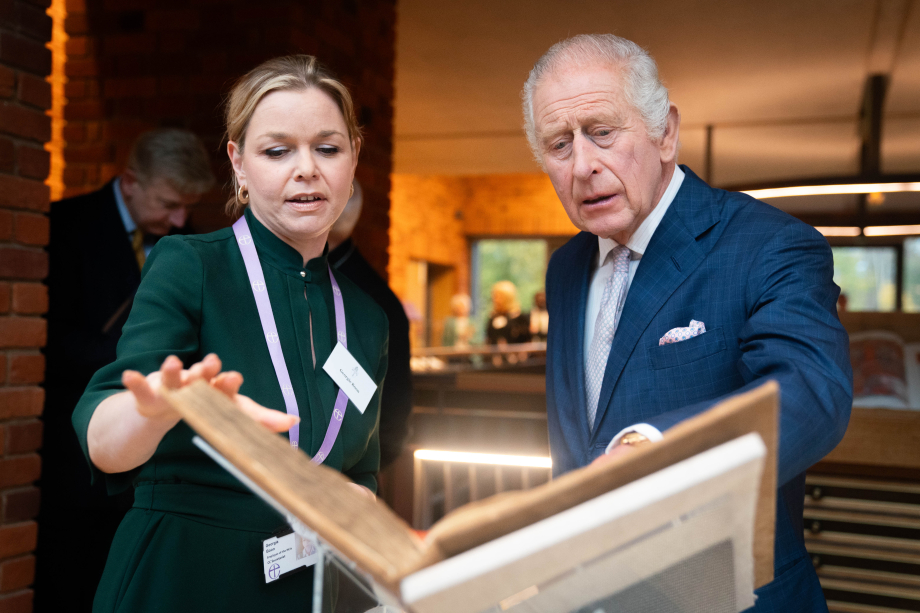 The King looks at items in the archive