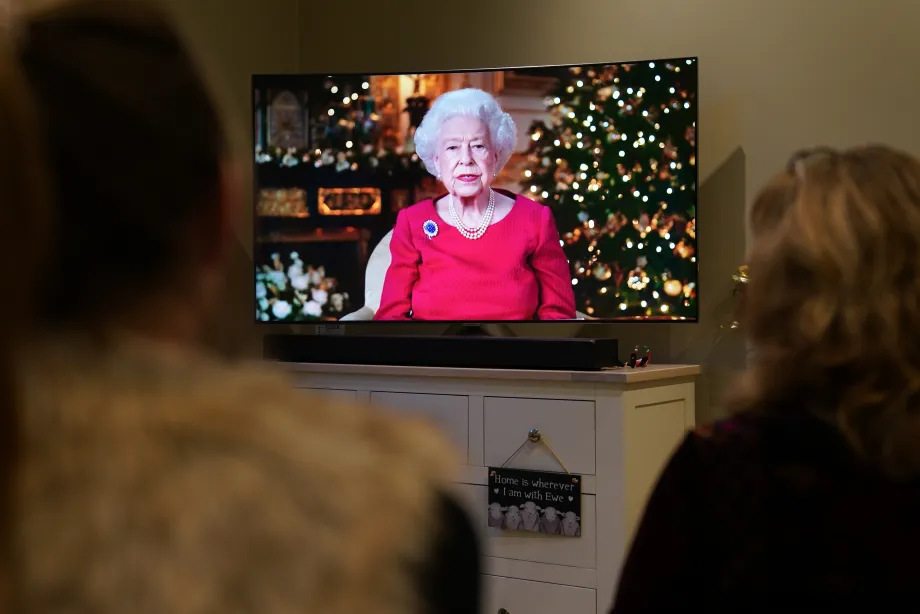 A family watch the Christmas Broadcast