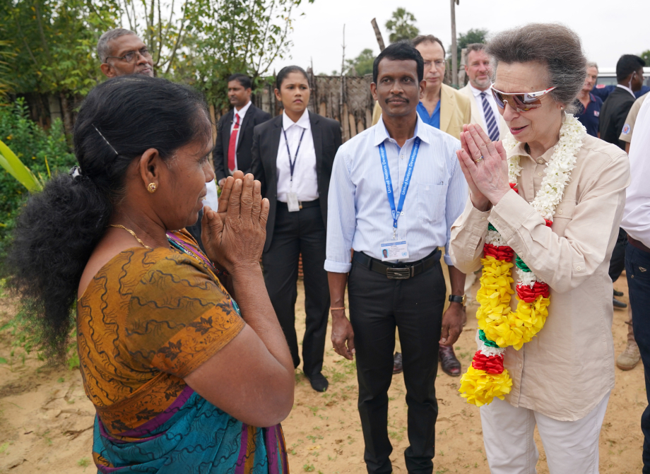 The Princess Royal receives a greeting and a garland of lotus flowers as she visits a resettlement village at the Halo Trust site in Muhamalai during day two of her visit to mark 75 years of diplomatic relations between the UK and Sri Lanka.