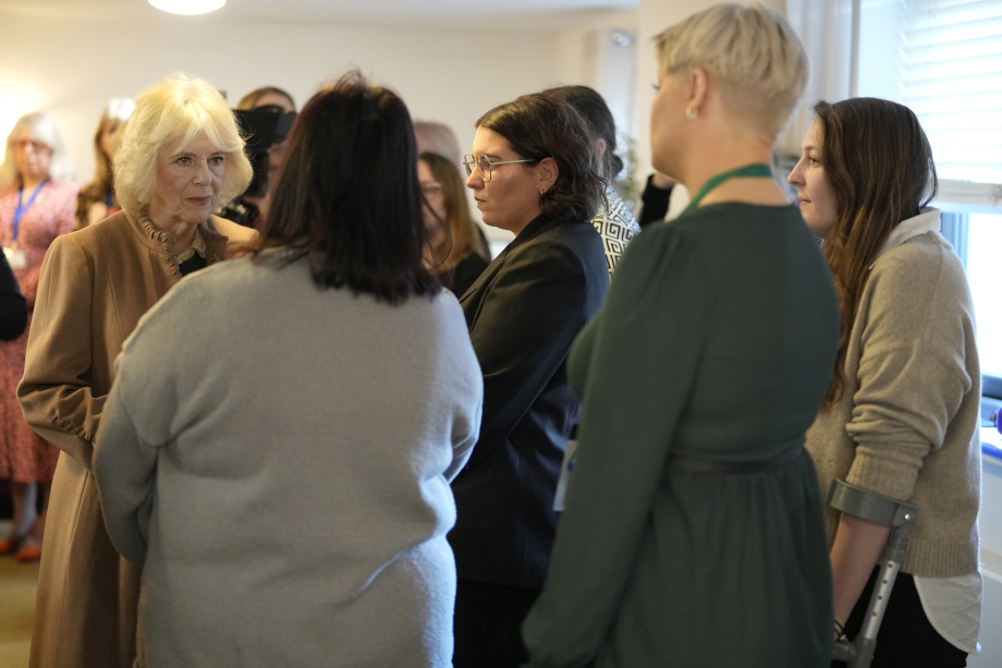 Queen Camilla speaks with attendees during a visit to the Swindon Domestic Abuse Support Service's (SDASS) in Wiltshire, to mark the charity's 50th anniversary and highlight their work in support, prevention, education and early intervention, including work with perpetrators of domestic abuse