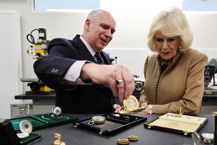 Queen Camilla reacts as she meets members of the public, during a visit to Deacon & Son, one of the oldest family run businesses in Swindon, Wilsthire, as the business celebrates 175 years of trading. 
