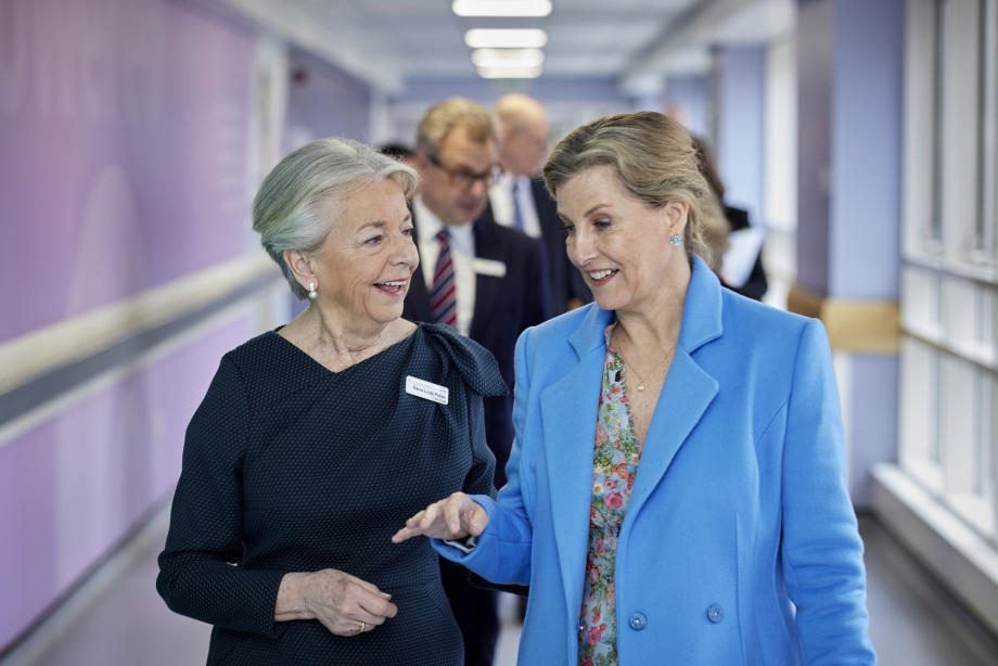 The Duchess of Edinburgh walking through the hospital ward.