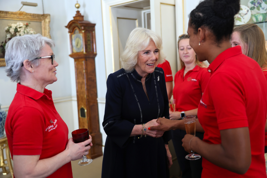 Queen Camilla, speaks to crew members as she hosts a reception for the 'Maiden' yachting crew, at Clarence House in London, to congratulate them on their unprecedented win of the Ocean Globe Race and becoming the first ever all-female crew to win an around-the-world yacht race