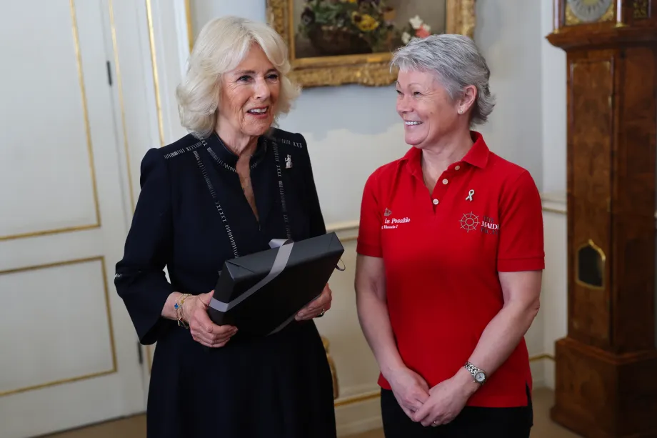 Queen Camilla, speaks to crew members as she hosts a reception for the 'Maiden' yachting crew, at Clarence House in London, to congratulate them on their unprecedented win of the Ocean Globe Race and becoming the first ever all-female crew to win an around-the-world yacht race
