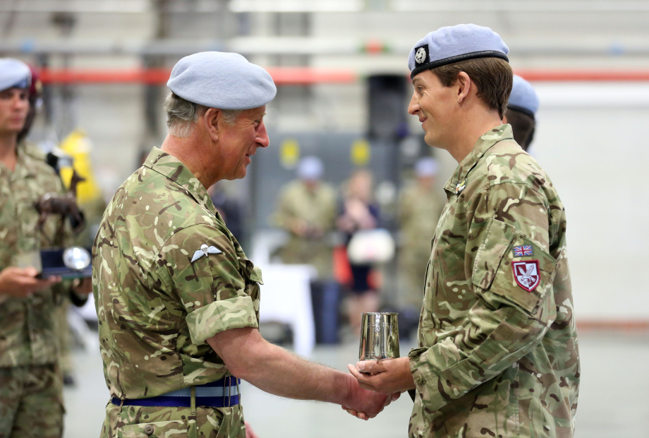 The King, as Prince of Wales, presents operational service medals to members of the Army Air Corps in 2013.