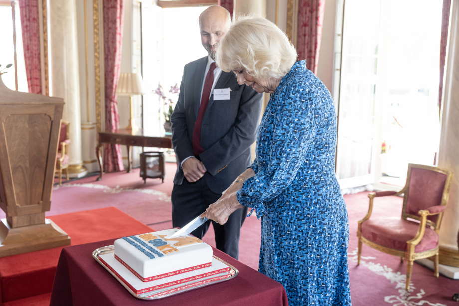 Queen Camilla cuts a cake as she hosts a reception at Buckingham Palace in London, to mark the 90th anniversary of Brooke, a charity dedicated to improving the lives of working horses, donkeys, and mules.