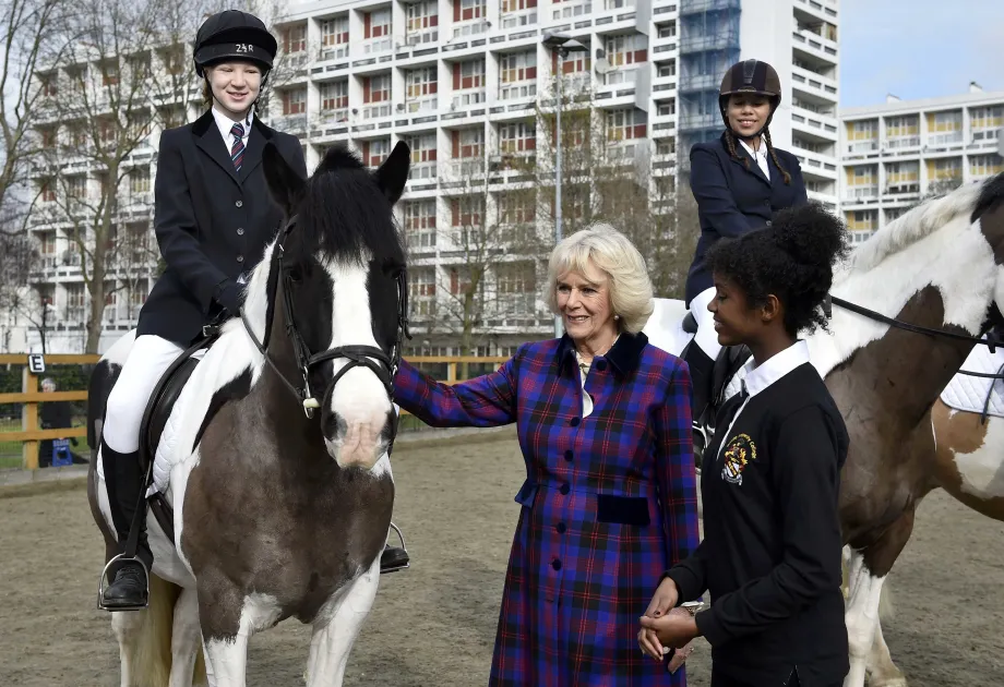 The then Duchess of Cornwall visits the Ebony Horse Club in Brixton