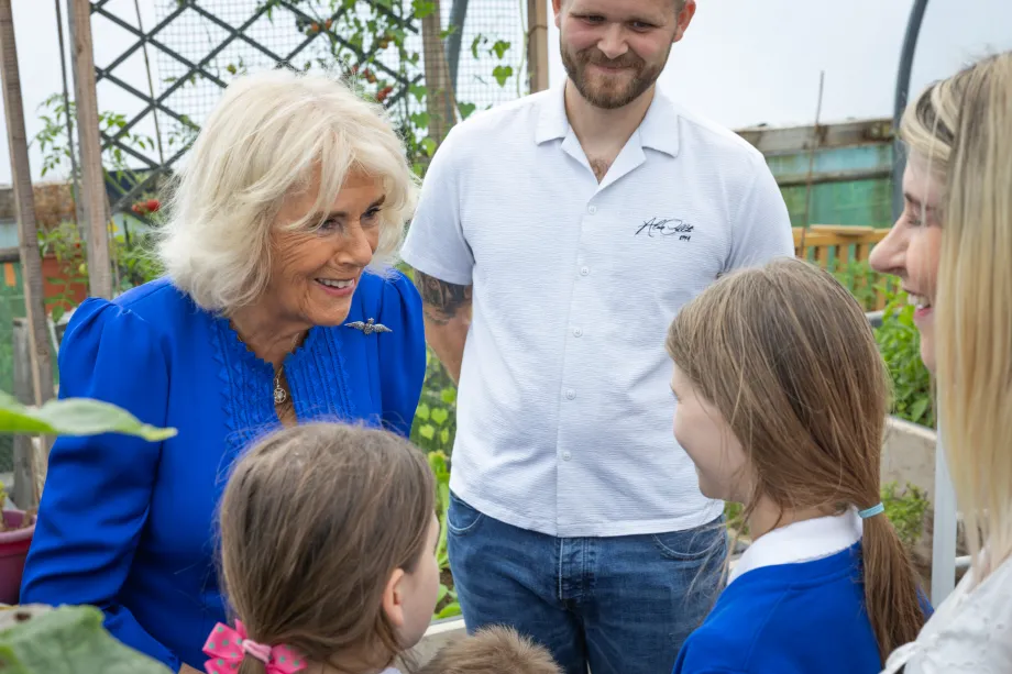 The Queen talks to two young children at RAF Leeming