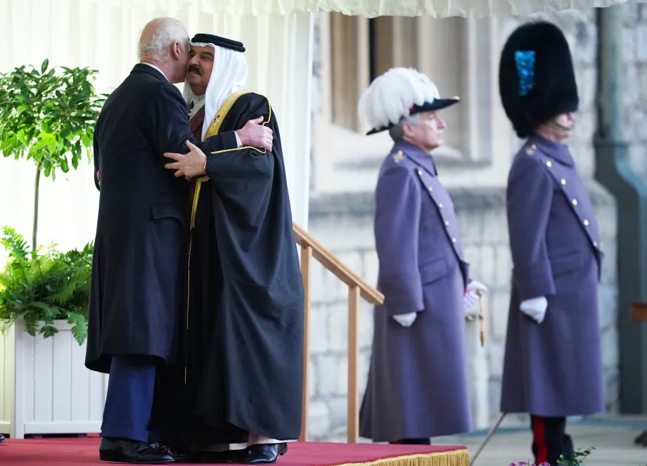 The King greets King Hamad of Bahrain on the Dias at Windsor Castle