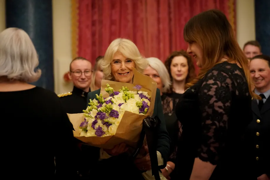 The Queen holding the bouquet of flowers